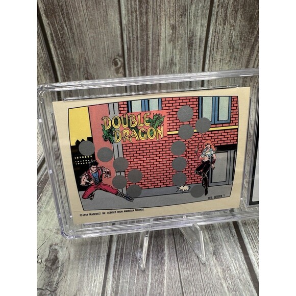 Double Dragon 1989 Topps Nintendo Scratch-Off PSA 10 GEM  Screen 1 of 10 Nintendo Game Pack (1989) Topps Double Dragon - Scratch-Off Cgc 8